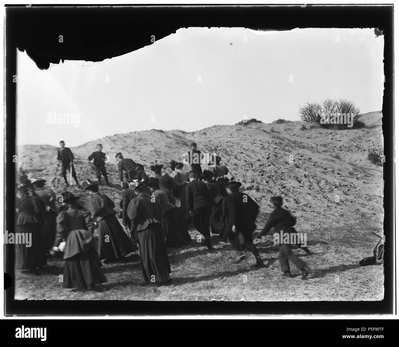 N/A. Nederlands: Beschrijving Bloemendaal e.o  Kraantje Lek. Onderwijzeressen van de Louise Bewaarschool hollen tegen een duin op.  Documenttype foto  Vervaardiger Olie``, Jacob (1834-1905)  Collectie Collectie Jacob Olie Jbz.  Datering 17 april 1897  Inventarissen http://stadsarchief.amsterdam.nl/archief/10019 Afbeeldingsbestand 10019A001461 Generated with Dememorixer . 17 April 1897.   Jacob Olie  (1834–1905)     Alternative names Jacob Olie Jbz. Jacob Olie Jbzn.  Description Dutch photographer  Date of birth/death 19 October 1834 25 April 1905  Location of birth/death Amsterdam Amsterdam  W Stock Photo